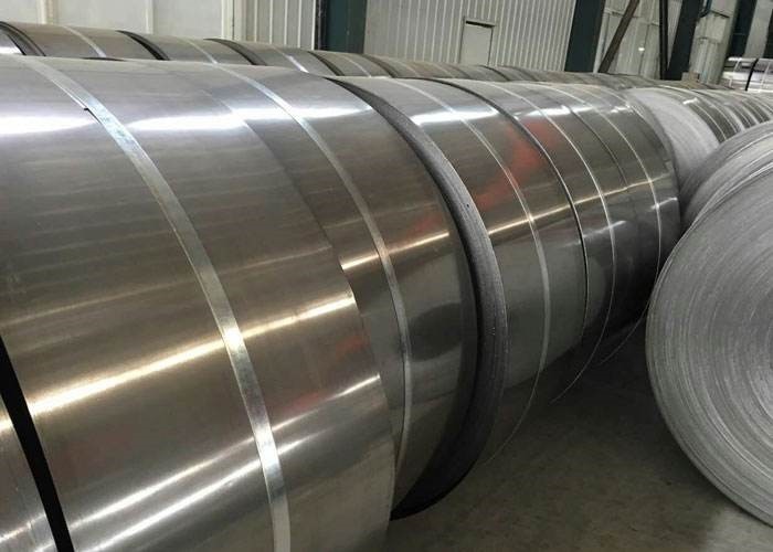 Hot-rolled stainless steel strips are made from hot-rolled stainless steel strips after further hot rolling. Compared with cold-rolled strip, it has higher dimensional accuracy, lower surface roughness, better surface quality, smoothness and higher strength. Therefore, a thinner hot-rolled strip can be used instead of a thicker cold-rolled strip for the same purpose to save the amount of steel, which is of great economic significance.  Hot-rolled stainless steel strip can be divided into five types according to the structure characteristics: austenite type, austenite-ferrite type, ferrite type, martensitic type and precipitation hardening type, which can be selected when used.  The difference between rolled strips  ① Hot rolling  Using slab (mainly continuous casting slab) as raw material, after heating, it is made into strip steel by rough rolling unit and finishing rolling unit. The hot steel strip coming out of the last rolling mill of finishing rolling is cooled to the set temperature by laminar flow, and then rolled into a steel strip coil by the coiler. The cooled steel strip coil undergoes different finishing operations according to the different needs of users. Lines (leveling, straightening, cross-cutting or slitting, inspection, weighing, packaging and marking, etc.) are processed into steel sheets, flat rolls and slitting steel strip products. To put it simply, after a piece of billet is heated (that is, the kind of red hot steel block that is burned), it is refined and rolled several times, and then trimmed and corrected into a steel plate. This is called hot rolling.  ② Cold rolling  Using hot-rolled steel coil as raw material, after pickling to remove oxide scale, cold continuous rolling is carried out, and the finished product is rolled hard coil. The cold work hardening caused by continuous cold deformation increases the strength, hardness and toughness and plastic index of rolled hard coil. , so the stamping performance will deteriorate and can only be used for parts with simple deformation. Hard-rolled coils can be used as raw materials for hot-dip galvanizing plants, because hot-dip galvanizing units are equipped with annealing lines. The weight of the rolled hard coil is generally 6~13.5 tons, and the hot-rolled pickled coil is continuously rolled at room temperature. The inner diameter is 610mm.  Product features: Because it has not been annealed, its hardness is very high (HRB is greater than 90), and its machinability is extremely poor. Only simple directional bending of less than 90 degrees (perpendicular to the coiling direction) can be performed.  In simple terms, cold rolling is processed and rolled on the basis of hot rolled coils. Generally speaking, it is a processing process such as hot rolling-pickling-cold rolling.  Cold rolling is processed from hot-rolled sheets at room temperature. Although the temperature of the steel sheet will be heated up during the processing, it is still called cold rolling. Due to the continuous cold deformation of hot rolling, the mechanical properties are relatively poor and the hardness is too high. It must be annealed to restore its mechanical properties, and those without annealing are called hard rolled coils. Hard-rolled coils are generally used to make products that do not need to be bent or stretched, and are bent on both sides or four sides with a thickness of 1.0 or less.